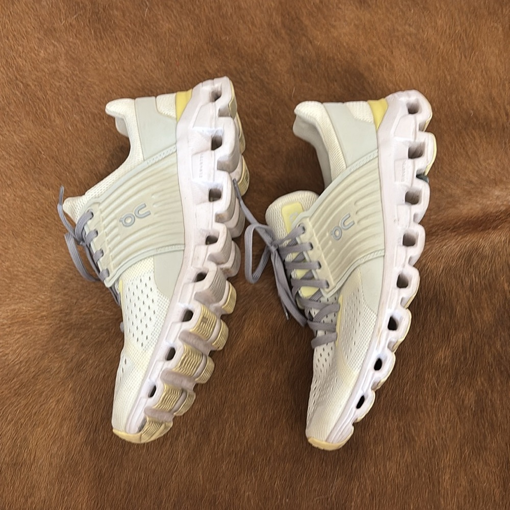 On Running White and Gray Athletic Shoes with Cushioned Soles